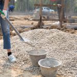 construction-workers-carrying-shovel-construction-site